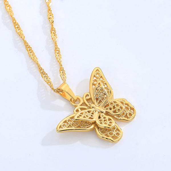 Gold butterfly necklace on a Singapore chain details