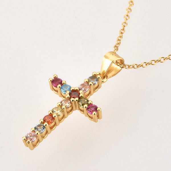 Colorful crystal cross on a golden necklace details