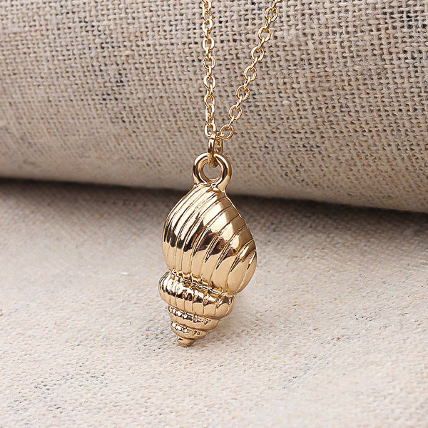 Gold conch seashell necklace display