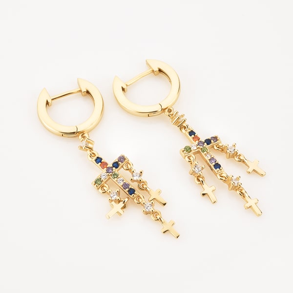 Gold cross chandelier earrings detail