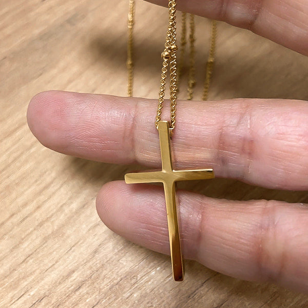 Gold cross necklace details