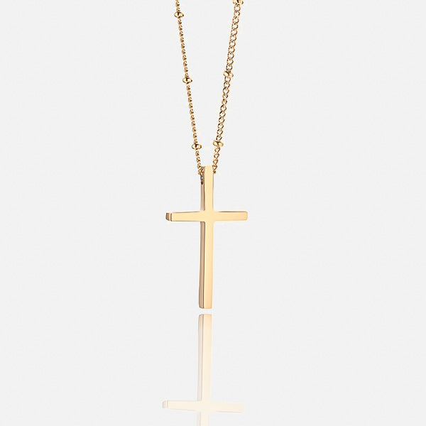Gold cross necklace display