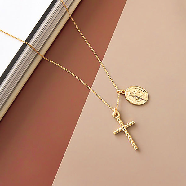 Gold cross and Virgin Mary pendant necklace display