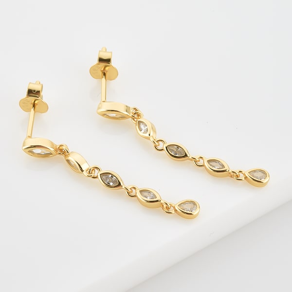 Gold crystal drop chain earrings detail