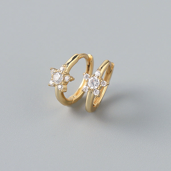 Gold crystal star huggie hoop earrings details