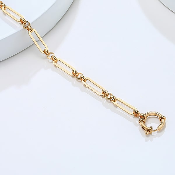 Gold designer oval link chain bracelet close up details