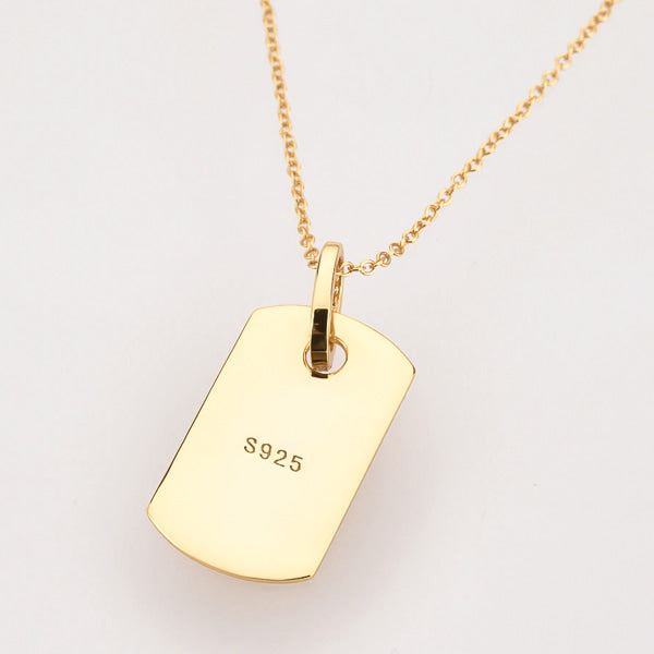 Gold dog tag necklace display