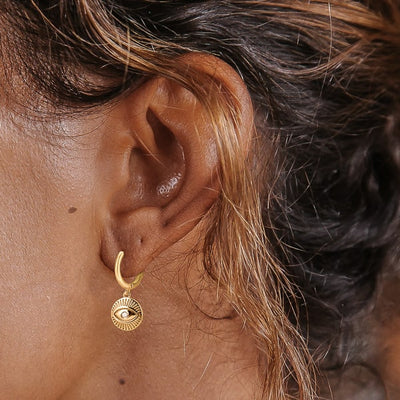 Gold eye of luck huggie hoop earrings