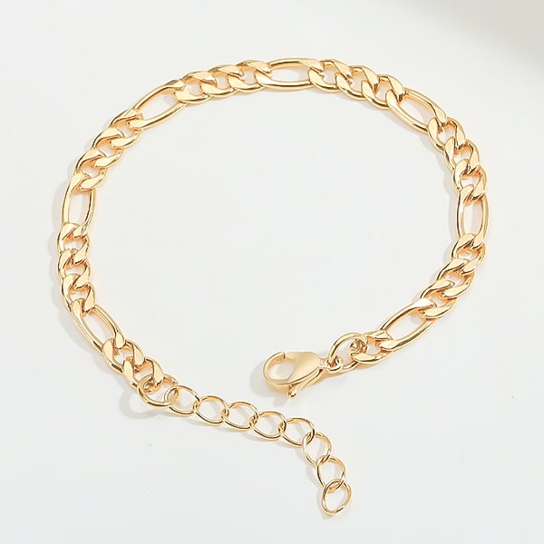 Gold figaro chain bracelet close up details