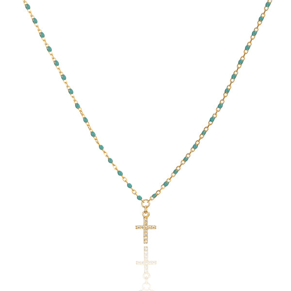 Gold necklace with green beads and a crystal cross
