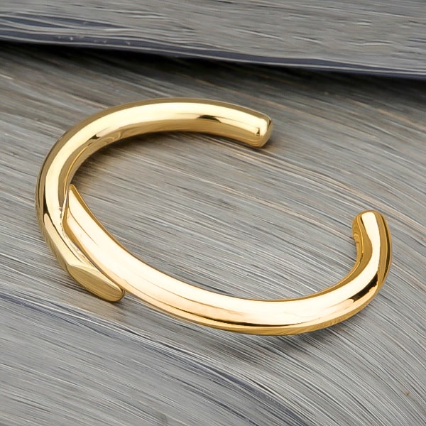 Gold harmony cuff bracelet viewed from its side