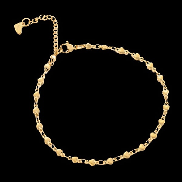 Gold heart chain anklet on a dark background