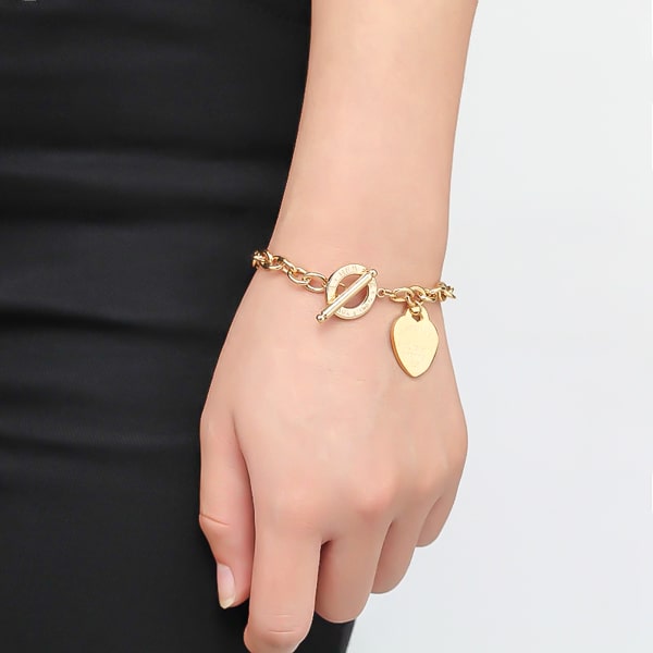 Gold love heart chain bracelet on a woman's wrist