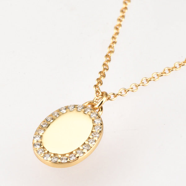 Gold oval pendant necklace display