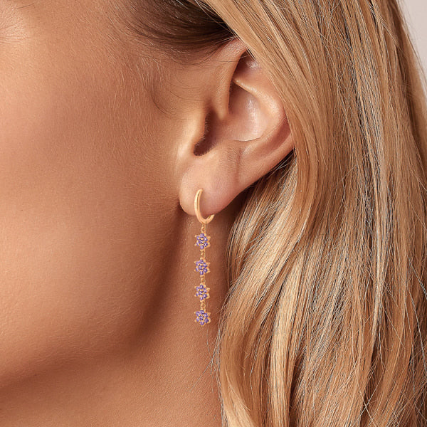 Gold purple crystal flower drop chain earrings on woman
