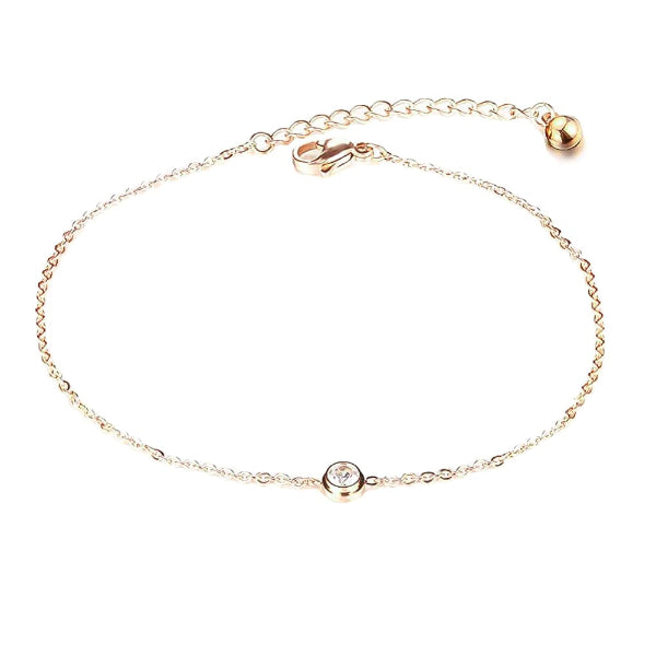 Gold simple crystal anklet on a white background