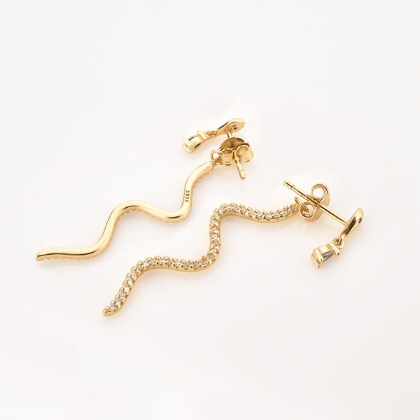Gold snake crystal drop earrings detail