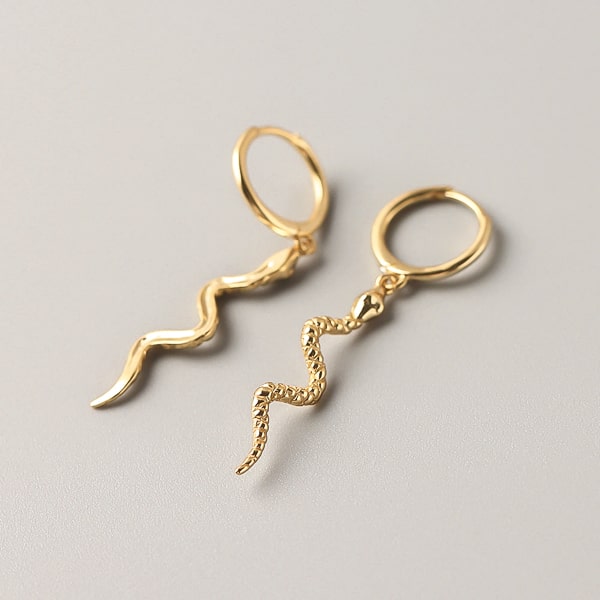 Gold snake drop earrings detail