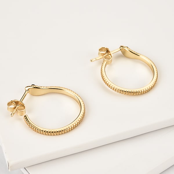 Gold snake hoop earrings detail
