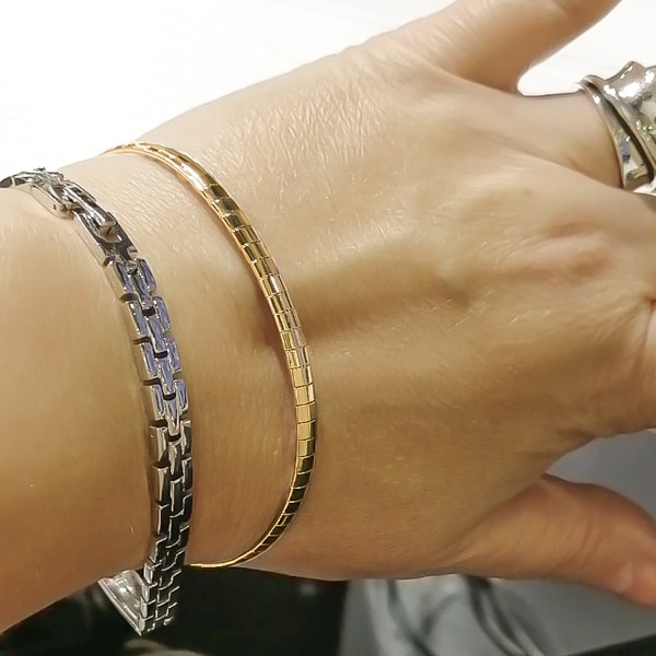 Gold square chain bracelet displayed on a woman's wrist