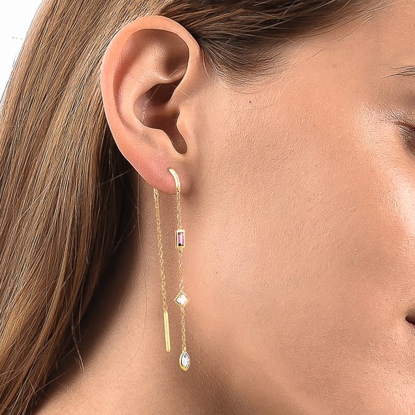 Woman wearing gold triple crystal threader earrings