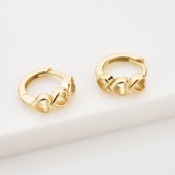 Gold triple heart huggie hoop earrings details
