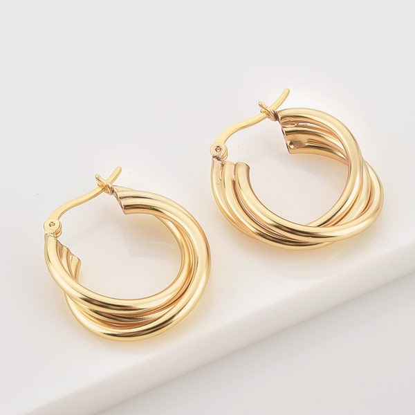 Gold triple twist hoop earrings detail