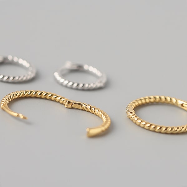 Gold twist huggie hoop earrings details