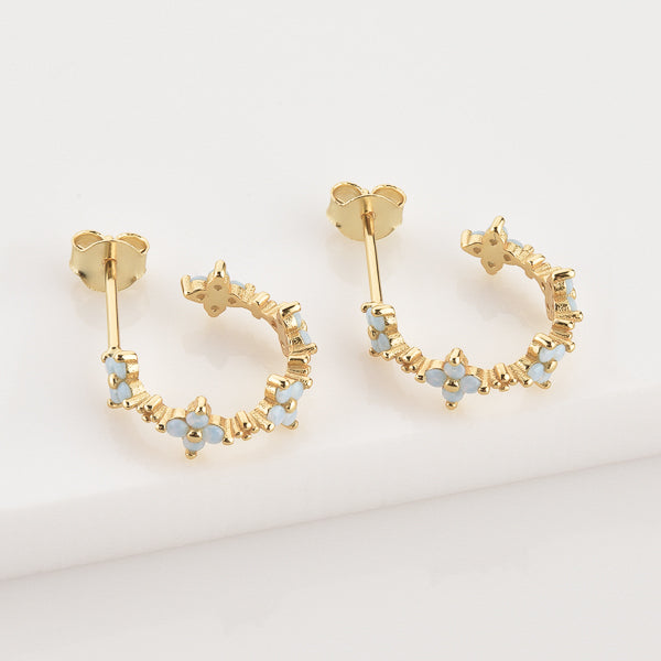 Gold floral hoop earrings details