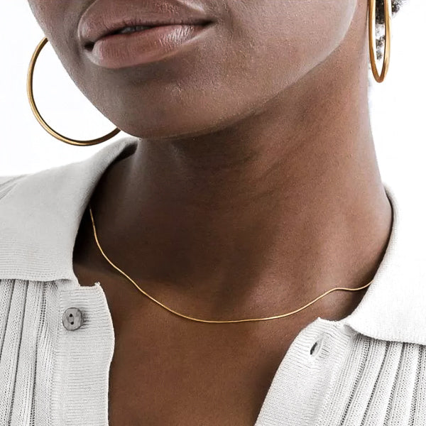 Woman wearing gold vermeil snake chain necklace