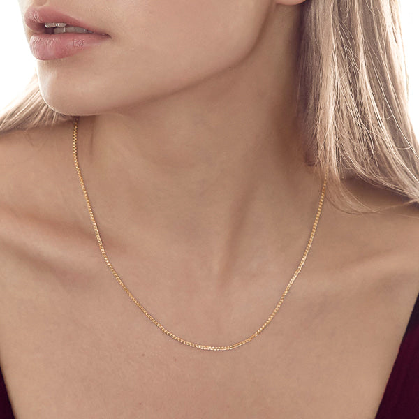 Woman wearing gold vermeil wheat chain necklace