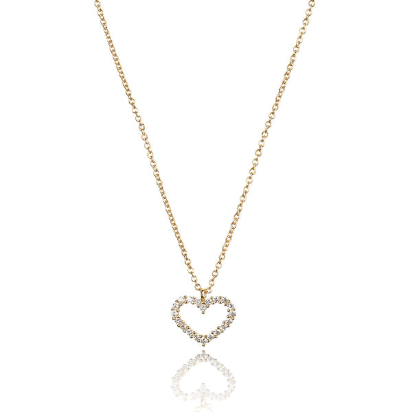 White crystal open heart on a gold necklace