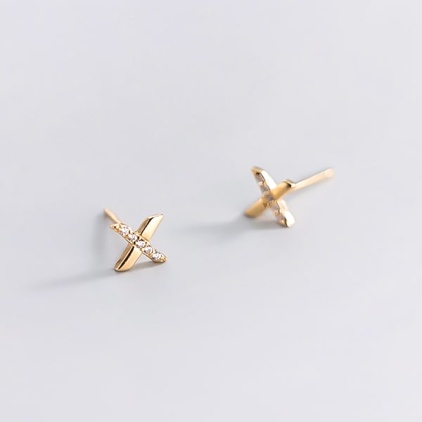 Gold x stud earrings detail