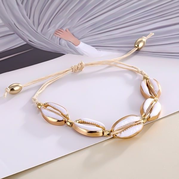 Golden cowrie seashell bracelet for summer