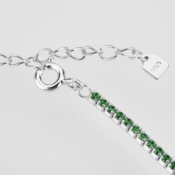 Details of the silver tennis choker necklace with green cubic zirconia stones