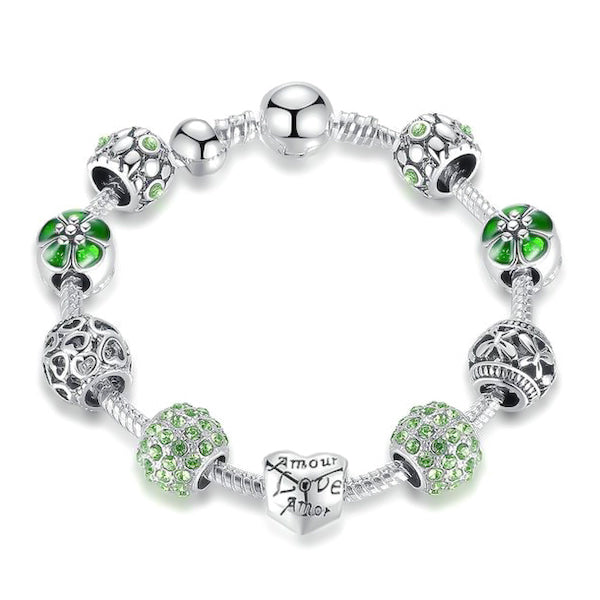 Green love charm bracelet with heart, flower, butterfly charms and green cubic zirconia
