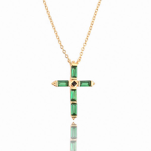 Green crystal cross on a gold necklace details