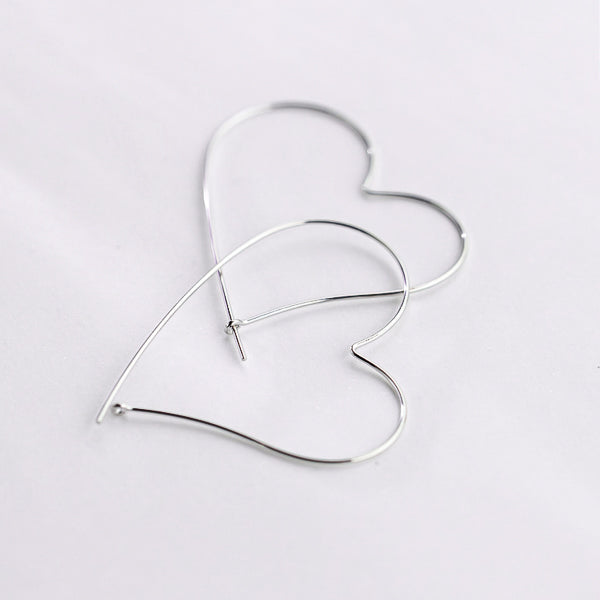 Large heart-shaped hoop earrings made of sterling silver