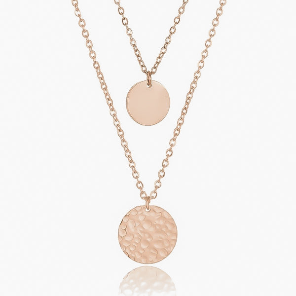 Smooth and hammered rose gold coin pendants on dainty layered chains