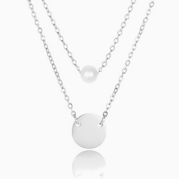 Pearl and coin charm on layered silver necklace chains