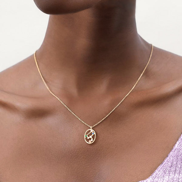 Woman wearing Leo constellation necklace