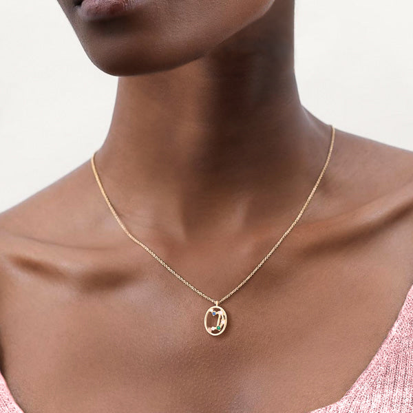 Woman wearing Libra constellation necklace