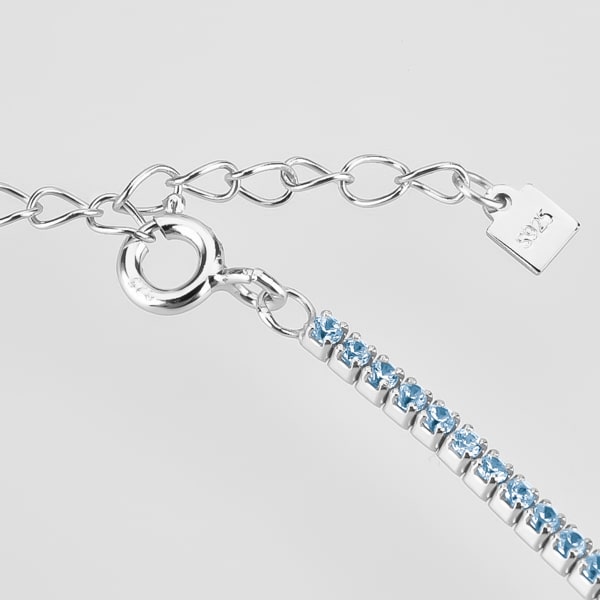 Details of the silver tennis choker necklace with light blue cubic zirconia stones