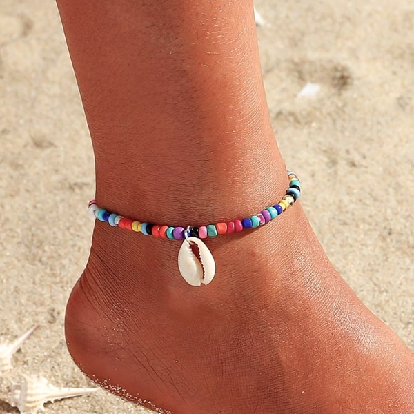 Multicolor beaded seashell anklet on a womans ankle