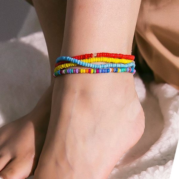 Multicolor handmade beaded anklet on womans ankle
