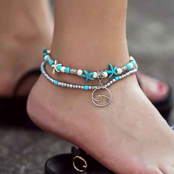 Ocean wave anklet on womans ankle