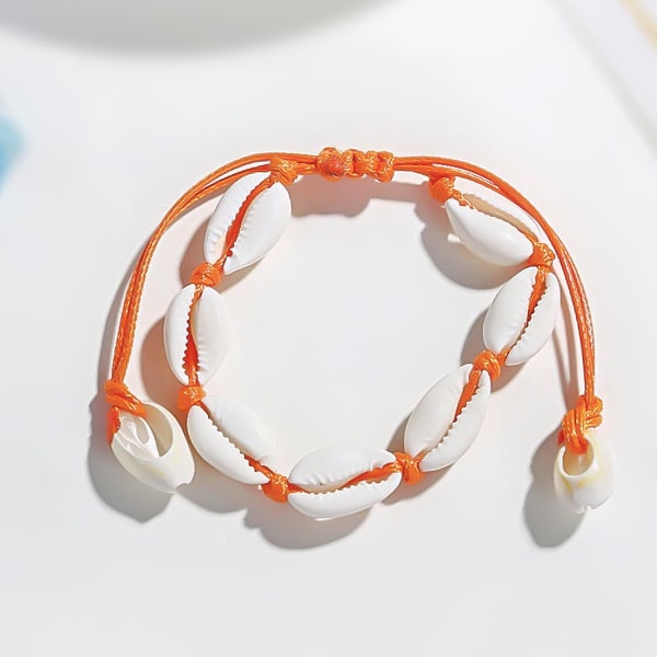 Orange cowrie shell ankle bracelet detailed close up