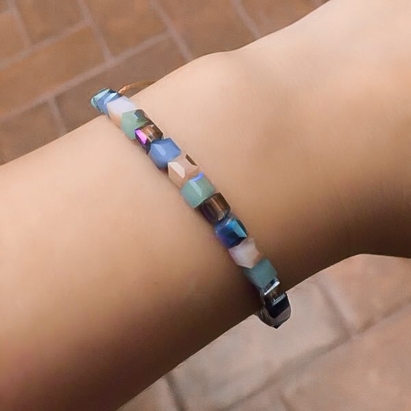 Woman wearing a pastel lilac square crystal bracelet