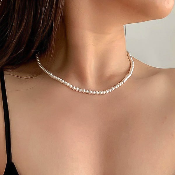 4mm pearl necklace displayed on a womans neck