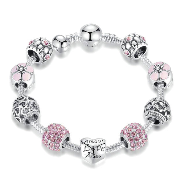 Pink love charm bracelet with heart, flower, butterfly charms and pink cubic zirconia
